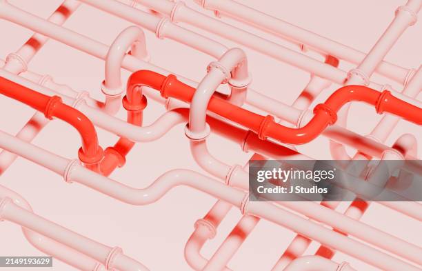 red pipe among pink pipes - pipe stock pictures, royalty-free photos & images