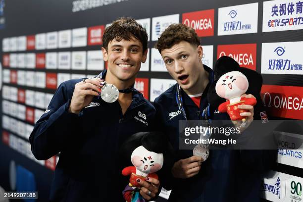 Tom Daley and Noah Williams of Great Britain pose with their silver medals after the Men's Synchronized 10m Platform Final during the World Aquatics...