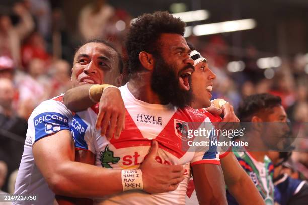 Mikaele Ravalawa of the Dragons celebrates with team mates after scoring a try during the round seven NRL match between St George Illawarra Dragons...