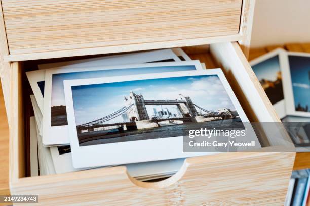 collection of instant film photos in a drawer - chest of drawers frame stock pictures, royalty-free photos & images