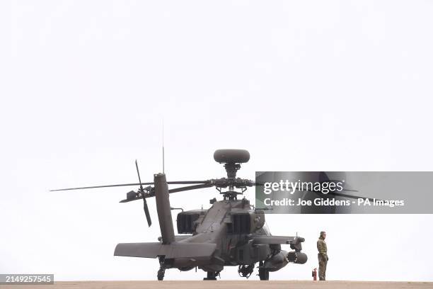 British Army Apache AH-64E attack helicopters are prepared for take off from Wattisham Flying Station in Suffolk, before heading to Estonia to train...