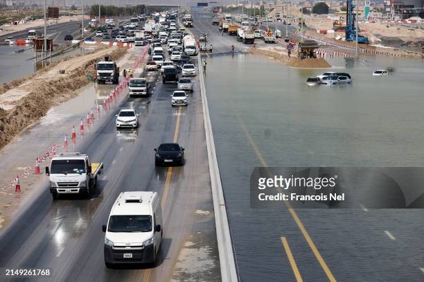 General view of traffic on a highway after flooding on April 19, 2024 in Dubai, United Arab Emirates. Atypically heavy rains in the UAE on Monday and...