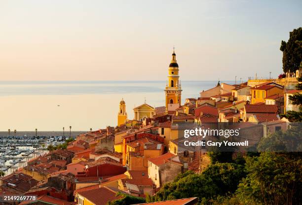 view across rooftops of menton - menton stock pictures, royalty-free photos & images