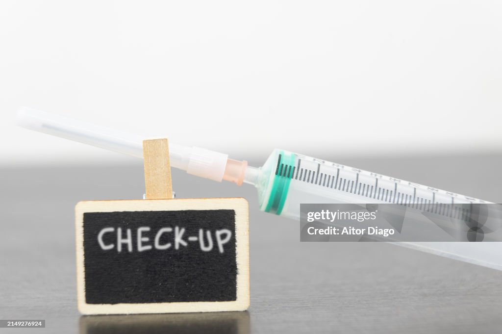 Syringe Check Checkup Written On A Blackboard With A Syringe On Top Of It High-Res ...