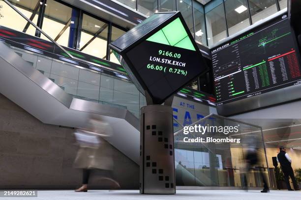 Stock price information displayed on a board at the London Stock Exchange Group Plc in the company's office atrium in the City of London, UK, on...
