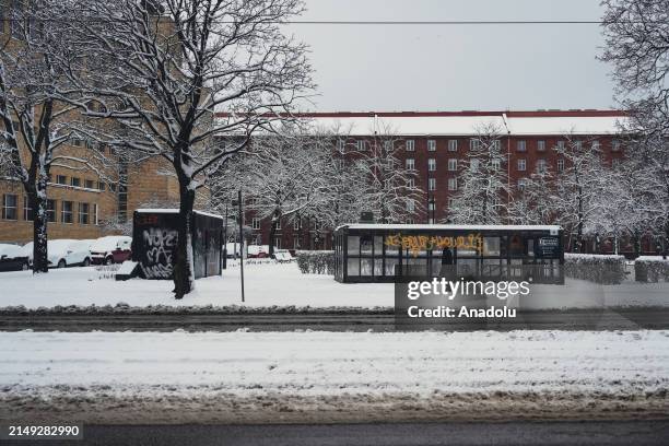 View of snow covered street during extreme cold weather in Helsinki, Finland on April 23, 2024. Trams in the city have been temporary stopped....