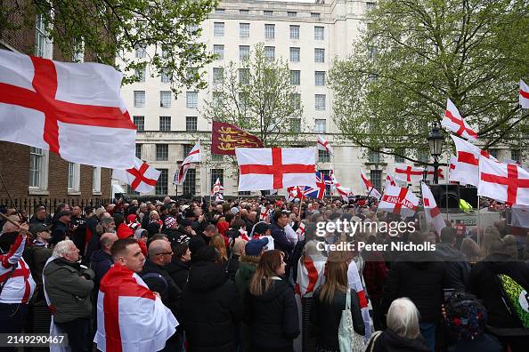 Sir George Riots People wave the St George's flag as they attend a demonstration at ...