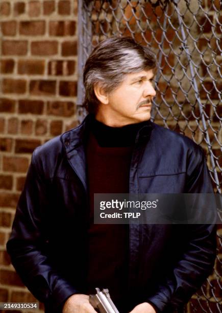 American actor Charles Bronson as the vigilante killer Paul Kersey on the set of the action movie 'Death Wish 3', circa 1985.