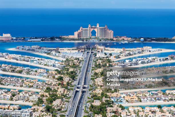 the palm jumeirah with atlantis hotel artificial island from above in dubai, united arab emirates, asia - palm-jumeirah imagens e fotografias de stock