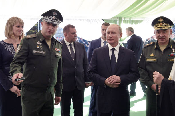 In this pool photograph distributed by Russian state owned agency Sputnik, Russia's President Vladimir Putin , Russian Defence Minister Sergei Shoigu...