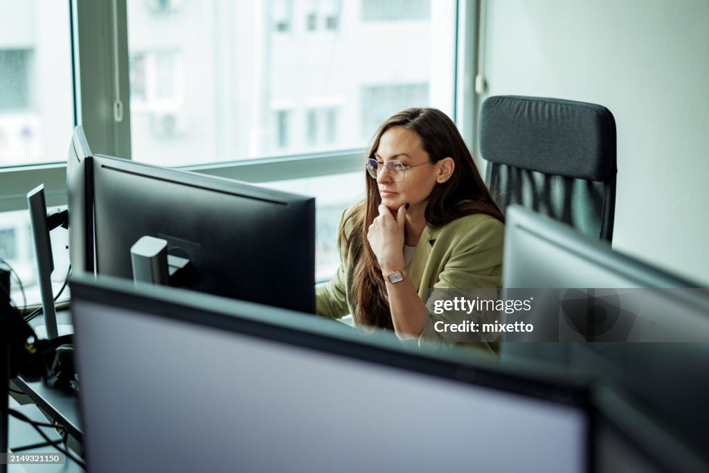 Young well dressed businesswoman working at the office