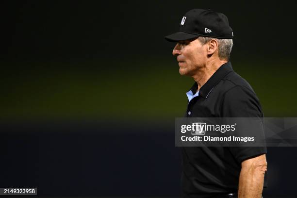 First base umpire Angel Hernandez looks on during the eighth inning of a spring training game between the Washington Nationals and the Houston Astros...