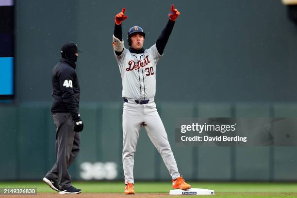Kerry Carpenter of the Detroit Tigers celebrates his double against the Minnesota Twins in the first inning at Target Field on April 19, 2024 in...