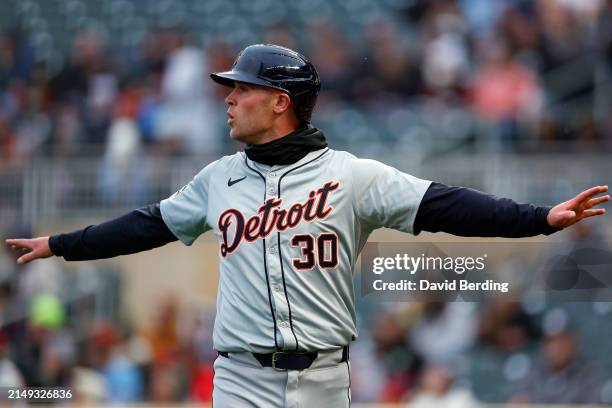 Kerry Carpenter of the Detroit Tigers reacts after scoring a run against the Minnesota Twins in the first inning at Target Field on April 19, 2024 in...
