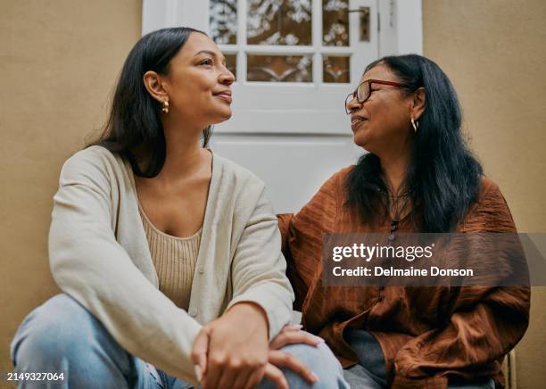 heart-to-heart: mother-daughter conversation on the stoop - deep conversation stock pictures, royalty-free photos & images