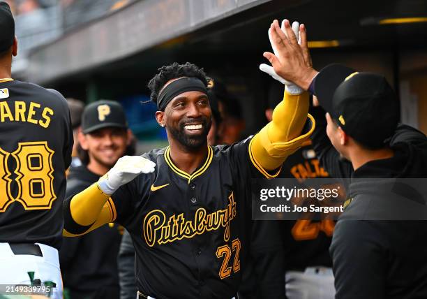 Andrew McCutchen of the Pittsburgh Pirates celebrates with teammates after hitting a solo home run during the first inning against the Milwaukee...