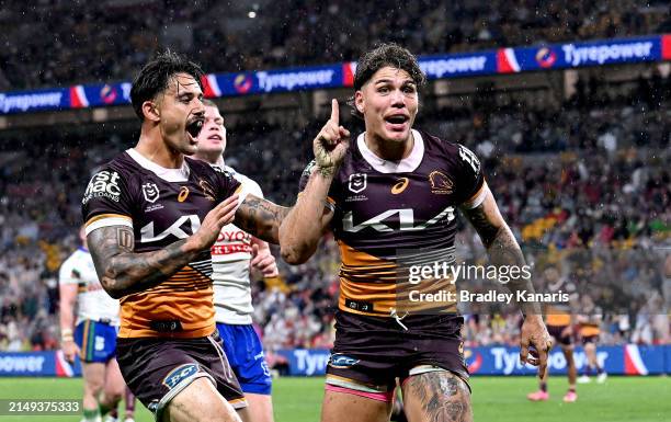 Reece Walsh of the Broncos celebrates after scoring a try during the round seven NRL match between the Brisbane Broncos and Canberra Raiders at...
