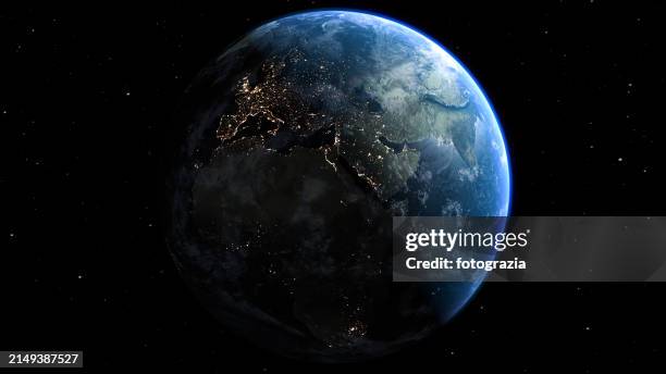 planet earth seen from space. view of city lights at night in europe - earth stockfoto's en -beelden