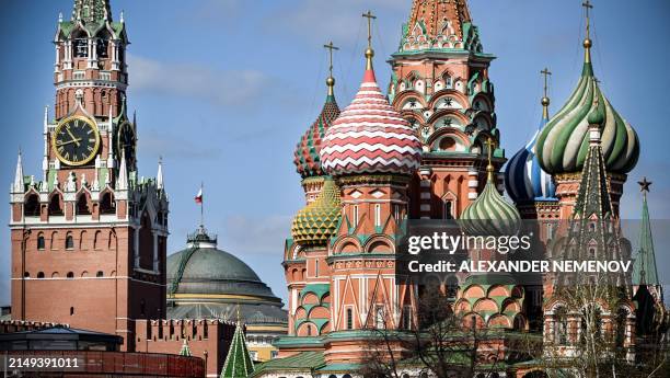 Photograph shows The Kremlin's Spasskaya tower and St. Basil's cathedral in downtown Moscow, on April 24, 2024.