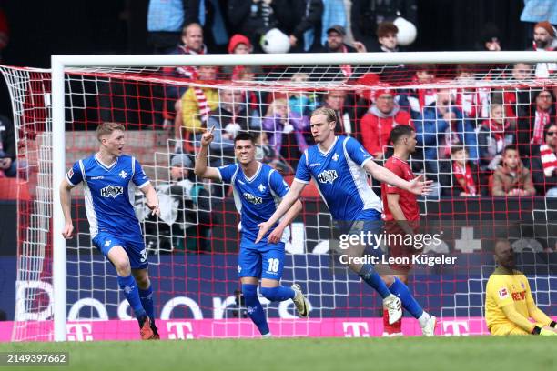 Christoph Klarer of SV Darmstadt 98 celebrates scoring his team's first goal during the Bundesliga match between 1. FC Köln and SV Darmstadt 98 at...