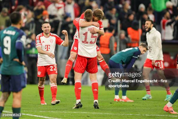 Joshua Kimmich of FC Bayern München celebrates the victory with teammate Eric Dier after the UEFA Champions League quarter-final second leg match...
