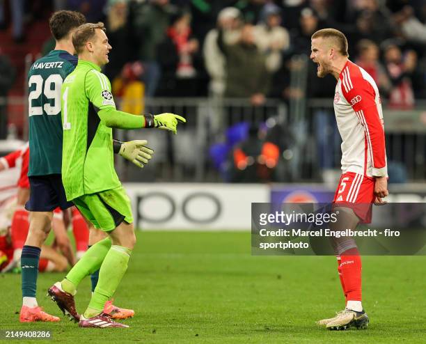 Goalkeeper Manuel Neuer of FC Bayern München celebrates the victory with teammate Eric Dier after the UEFA Champions League quarter-final second leg...