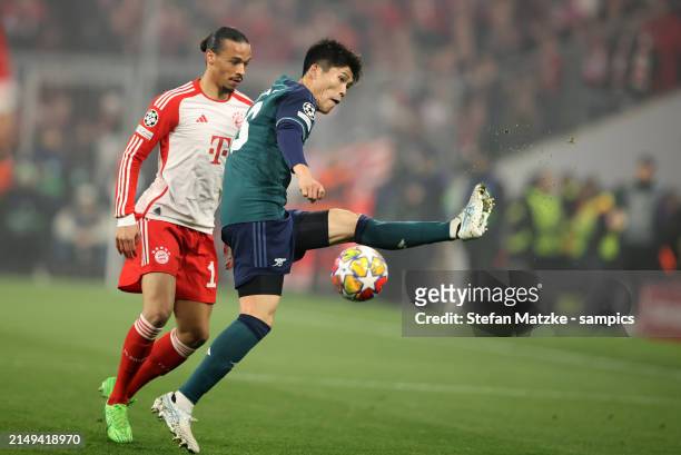 Takehiro Tomiyasu of FC Arsenalvies with Leroy Sane of Bayern Muenchen during the UEFA Champions League quarter-final second leg match between FC...