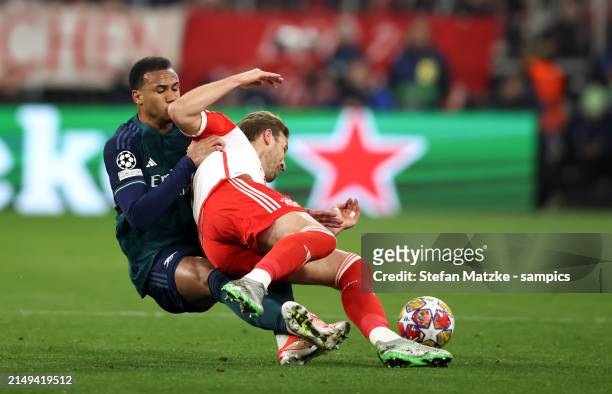 Harry Kane of Bayern Muenchen vies with Gabriel Magalhaes of FC Arsenal during the UEFA Champions League quarter-final second leg match between FC...