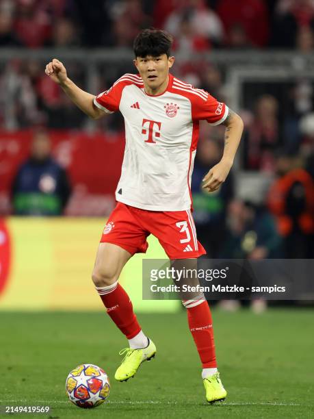 Min Jae Kim of FC Bayern Muenchen runs with a ball during the UEFA Champions League quarter-final second leg match between FC Bayern München and...
