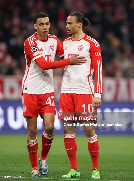 Jamal Musiala of Bayern Muenchen with Leroy Sane of Bayern Muenchen during the UEFA Champions League quarter-final second leg match between FC Bayern...