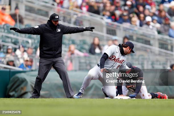Byron Buxton of the Minnesota Twins steals third base against Matt Vierling of the Detroit Tigers on a wild pitch in the second inning at Target...