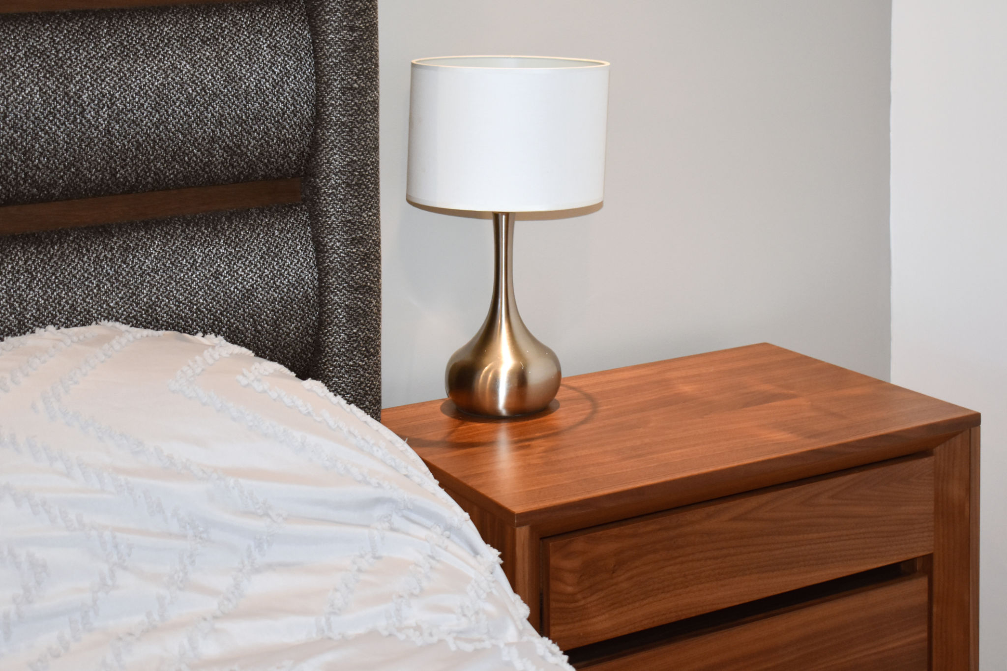 Nightstand next to the bed with lamp Nightstand next to the bed with lamp