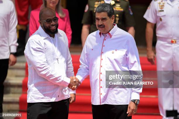 Venezuela's President Nicolas Maduro welcomes Saint Kitts and Nevis' Non-Resident Ambassador-Designate to Venezuela, Norgen Wilson, upon his arrival...