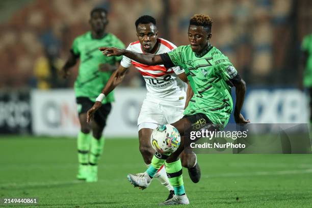 Ibrahima Ndiaye of Zamalek is battling for the ball with Abdul Aziz Issah of Dreams during the CAF Confederations Cup knockout stage semifinal match...