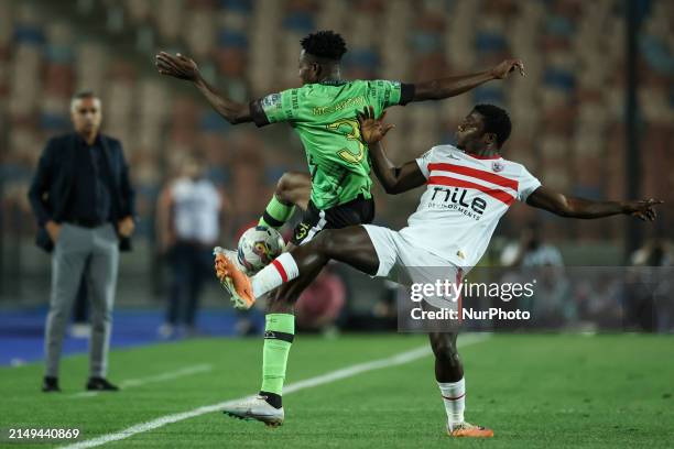 Samson Akinyoola of Zamalek is battling for the ball with Mccarthy Ofori of Dreams during the CAF Confederations Cup knockout stage semifinal match...