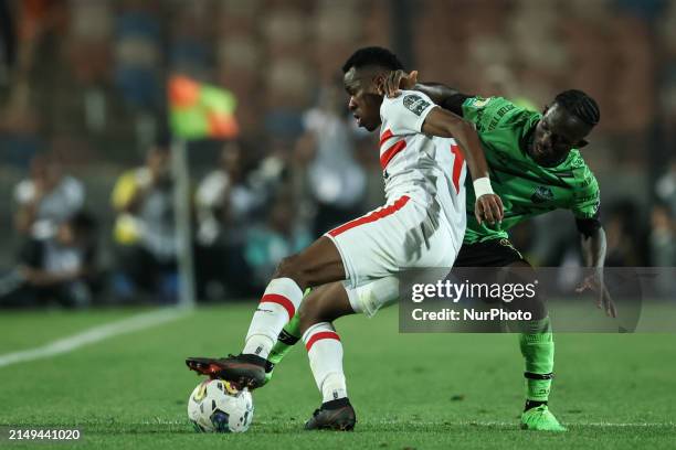 Ibrahima Ndiaye of Zamalek is battling for the ball with Godfred Atuahene of Dreams during the CAF Confederations Cup knockout stage semifinal match...