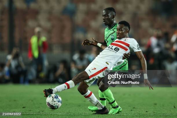 Ibrahima Ndiaye of Zamalek is battling for the ball with Godfred Atuahene of Dreams during the CAF Confederations Cup knockout stage semifinal match...