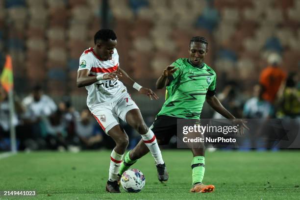 Ibrahima Ndiaye of Zamalek is battling for the ball with Sulemana Suhiyini of Dreams during the CAF Confederations Cup knockout stage semifinal match...