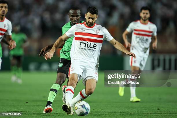 Hamza Mathlouthi of Zamalek is battling for the ball with John Antwi Issah of Dreams during the CAF Confederations Cup knockout stage semifinal match...