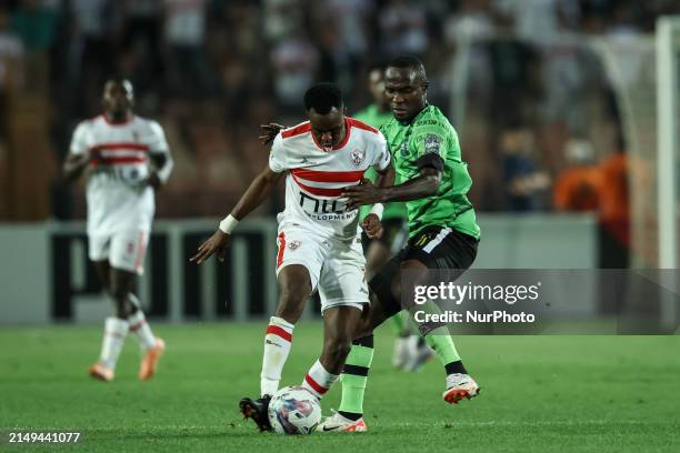 Ibrahima Ndiaye of Zamalek is battling for the ball with John Antwi of Dreams during the CAF Confederations Cup knockout stage semifinal match...