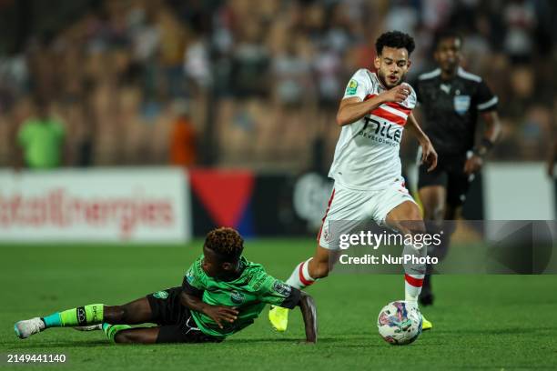 Nabil Donga of Zamalek is battling for the ball with Abdul Aziz Issah of Dreams during the CAF Confederations Cup knockout stage semifinal match...