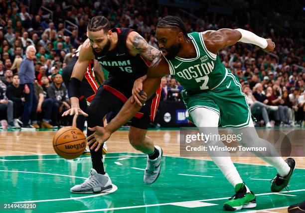 Jaylen Brown of the Boston Celtics and Caleb Martin of the Miami Heat go for a loose ball during the third quarter of game two of the Eastern...