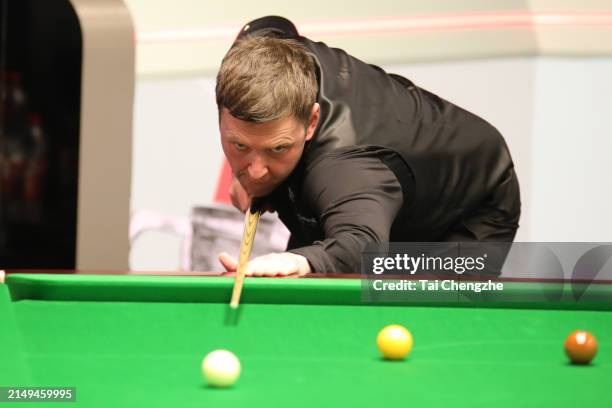 Ricky Walden of England plays a shot in the first round match against Tom Ford of England on day one of 2024 Cazoo World Snooker Championship at...