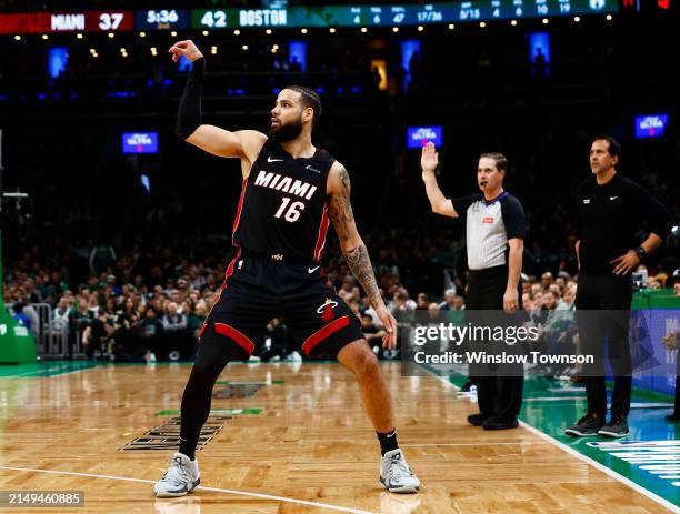Caleb Martin of the Miami Heat watches a three-point shot go in against the Boston Celtics during the second quarter of game two of the Eastern...