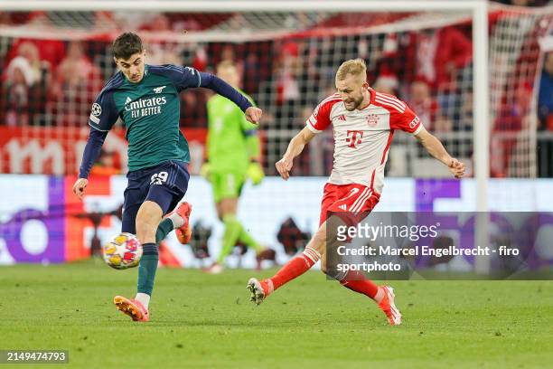 Kai Havertz of Arsenal FC and Konrad Laimer of FC Bayern München compete for the ball during the UEFA Champions League quarter-final second leg match...