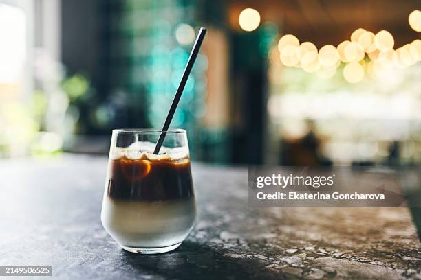 chilled iced latte on a marble table with copy space - dark marble table stock pictures, royalty-free photos & images