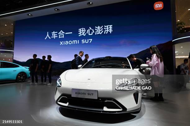 Xiaomi SU7 model electric car is displayed at the Beijing Auto Show in Beijing on April 25, 2024.