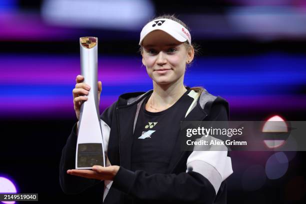Elena Rybakina of Kazakhstan poses for a photo with the Porsche Tennis Grand Prix Stuttgart 2024 trophy following her victory over Marta Kostyuk of...