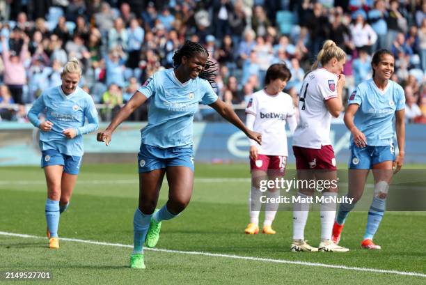 Khadija Shaw of Manchester City celebrates after scoring her team's third goal during the Barclays Women's Super League match between Manchester City...