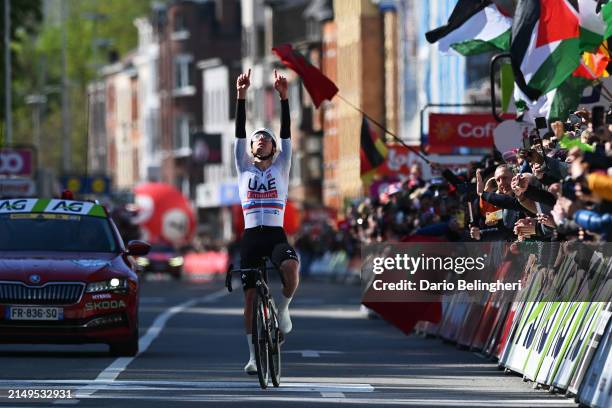Tadej Pogacar of Slovenia and UAE Team Emirates celebrates at finish line as race winner during the 110th Liege - Bastogne - Liege 2024, Men's Elite...